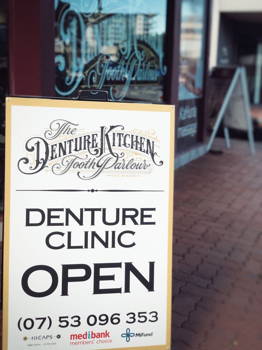 A Sign That Says Denture Clinic Open on It — The Denture Kitchen in Maroochydore, QLD