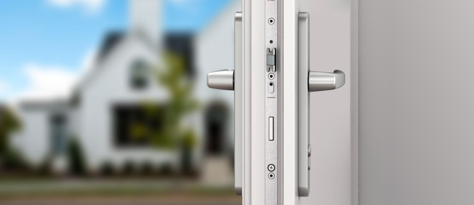 Vista aerea di un edificio con un camion e un rimorchio, accanto a una stazione di servizio in una città.