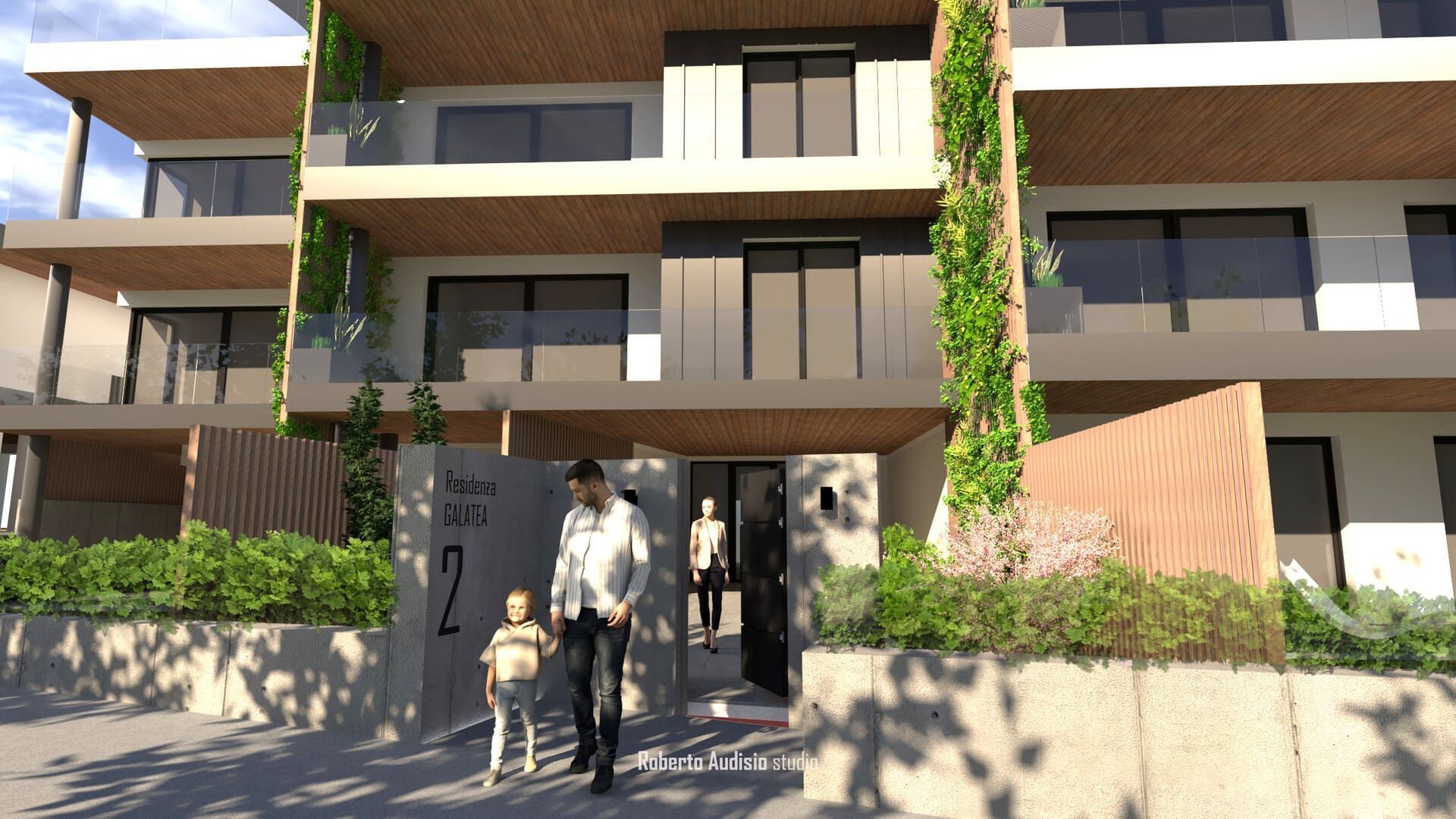 Ingresso di un moderno condominio con persone che entrano, circondate da piante.