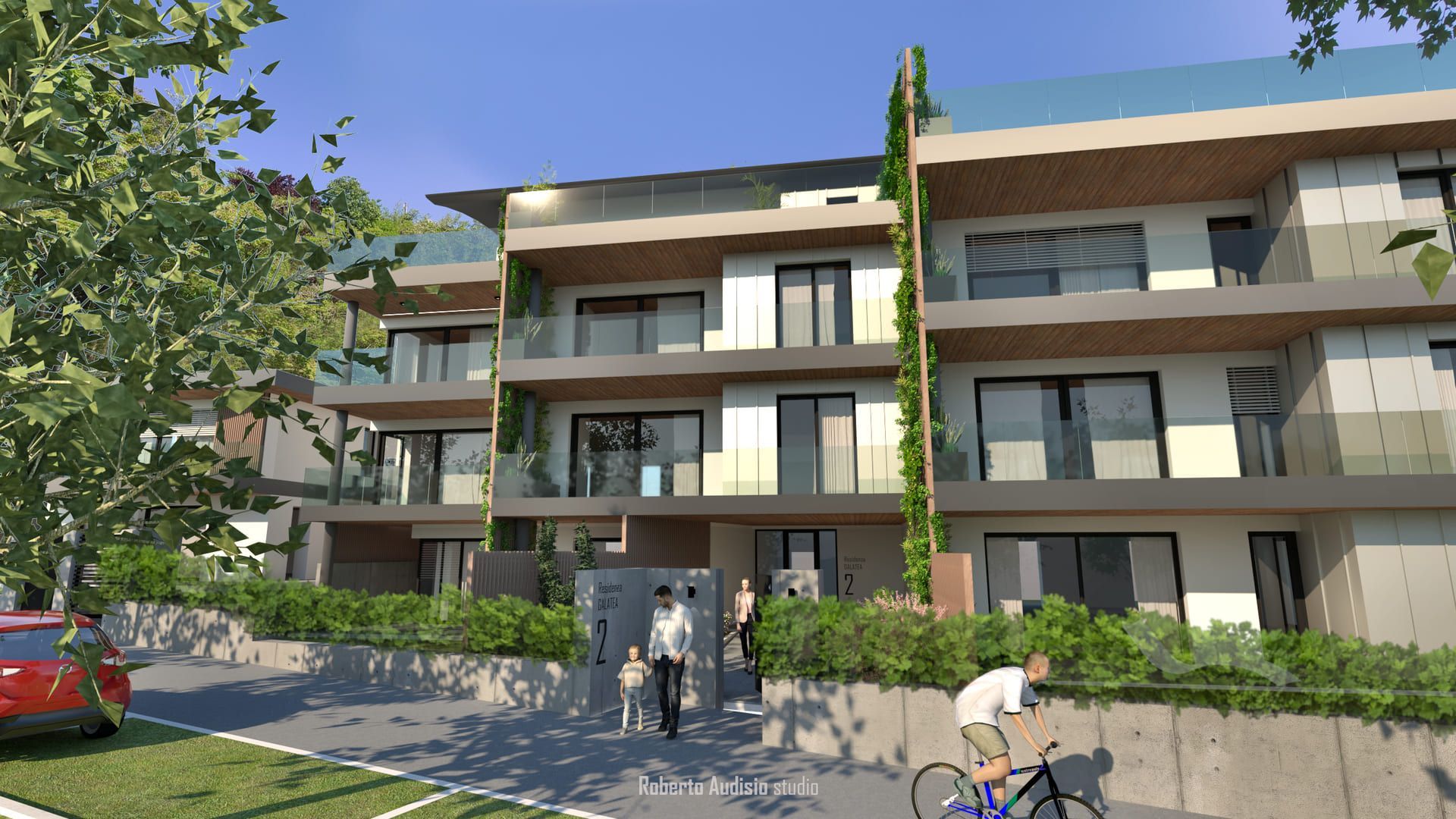 Moderni edifici residenziali a più piani; persone che camminano e vanno in bicicletta vicino all'ingresso.