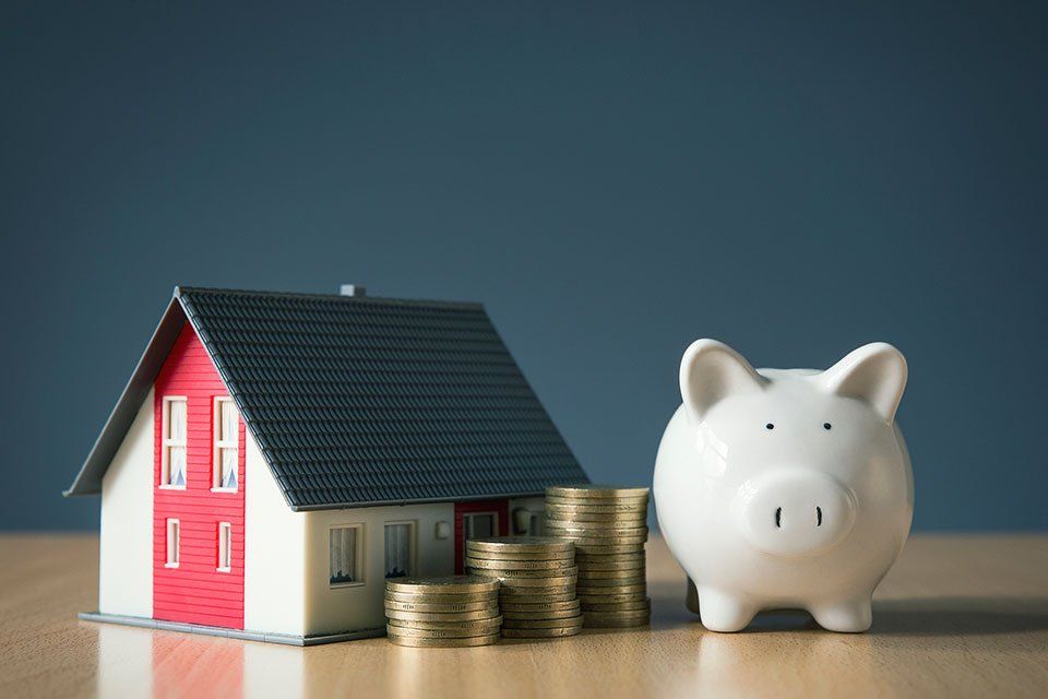 Money Savings for House with Piggy Bank Concept — Flipping Houses in Buford, GA