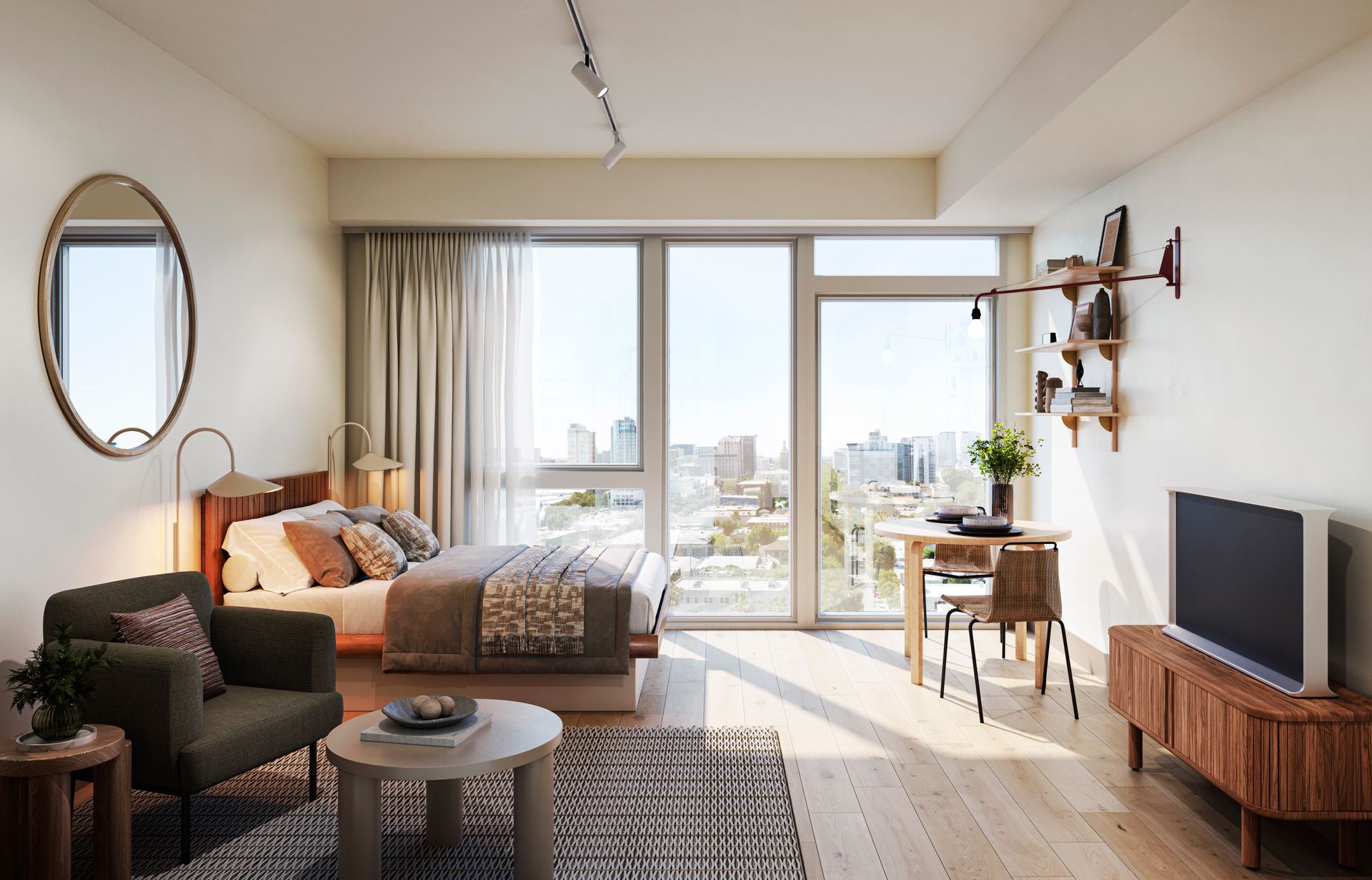 Bright studio apartment with large window showcasing city view, hardwood floors, and modern furniture.