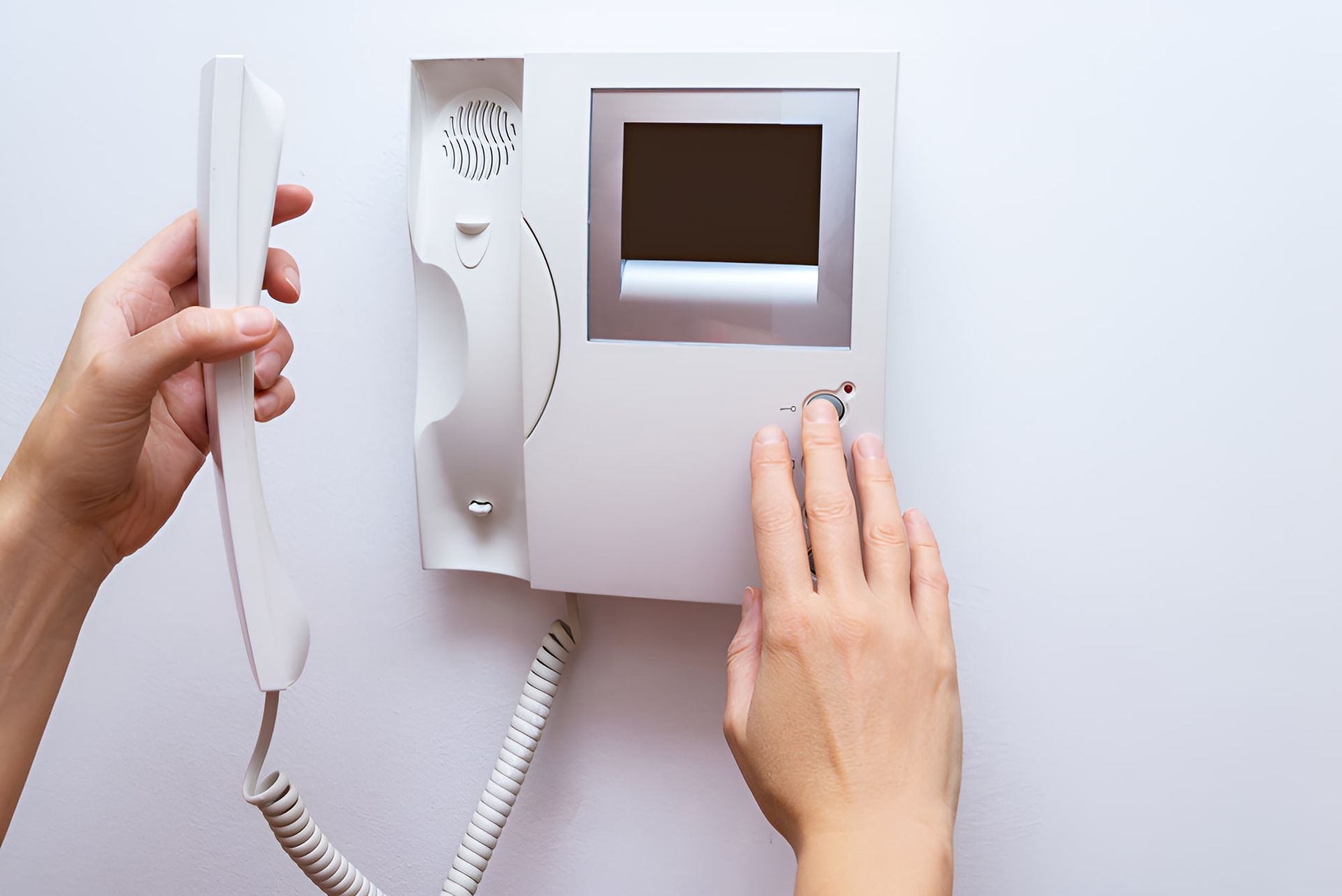 A Person is Pressing a Button on a Video Doorbell — CTE Systems In Old Bar, NSW