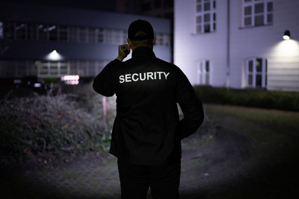 A Security Guard is in Front of a Building — CTE Systems In Taree, NSW