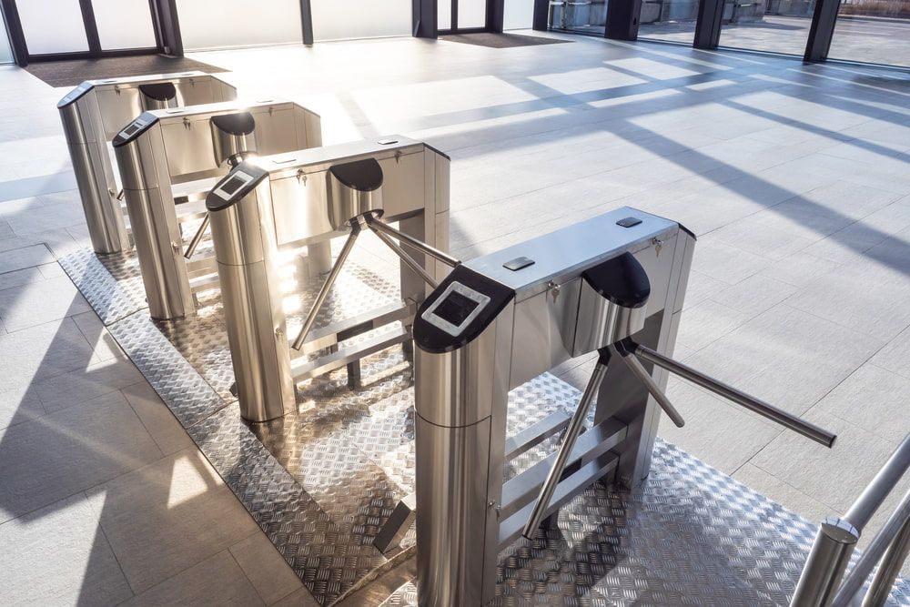 A Row of Turnstiles Are Lined Up in a Building — CTE Systems In Forster, NSW