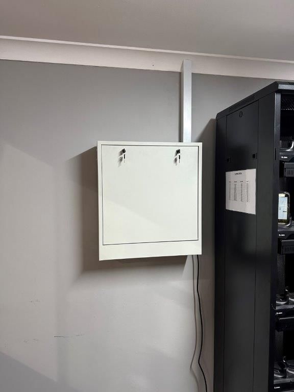 A Person is Pressing a Button on an Intercom System — CTE Systems In Tuncurry, NSW