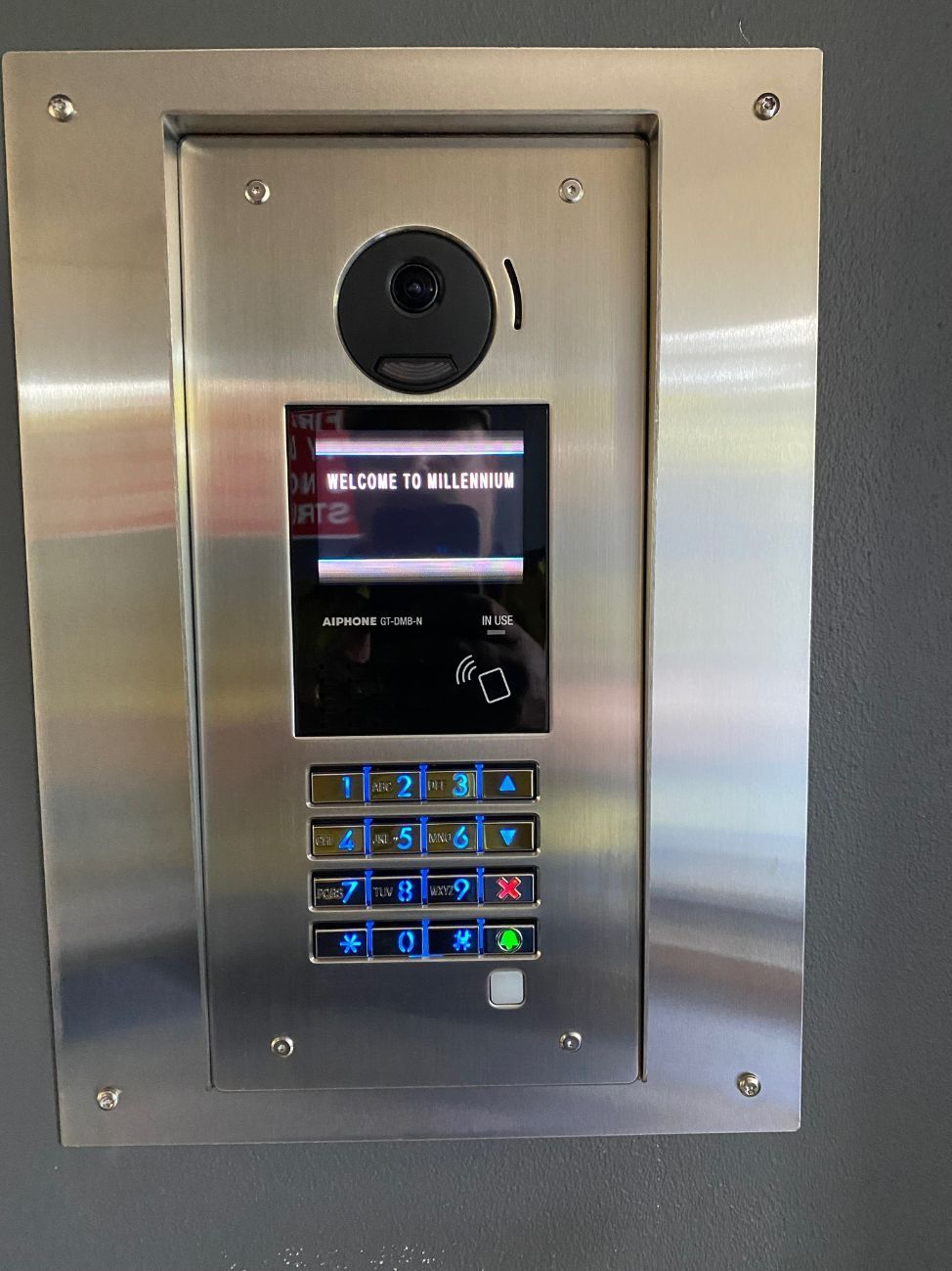 A Stainless Steel Doorbell With a Screen and Buttons — CTE Systems In Tuncurry, NSW