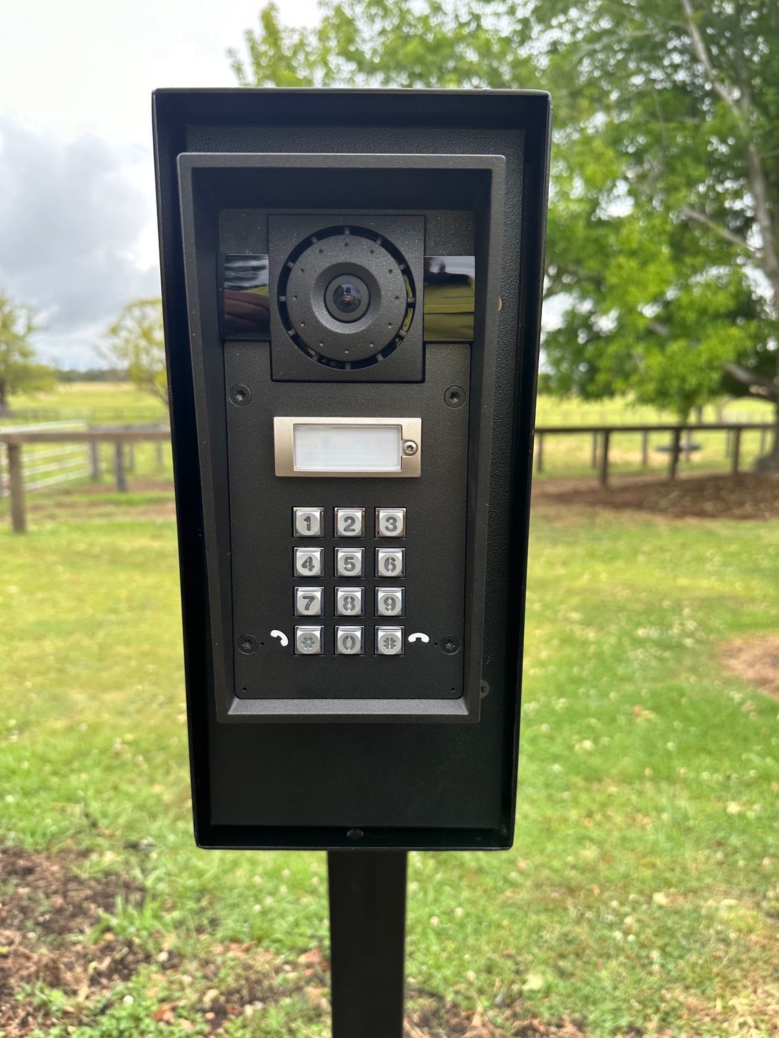A Person is Pressing a Button on a Doorbell — CTE Systems In Taree, NSW