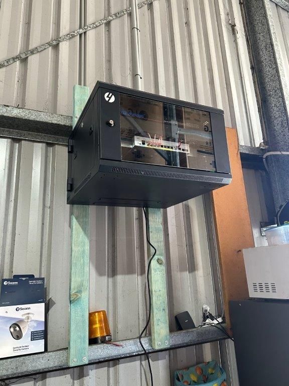 A Man is Working on a Security System — CTE Systems In Hallidays Point, NSW