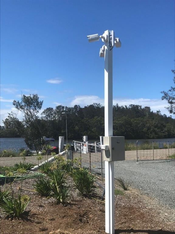 A Man is Installing a Security Camera — CTE Systems In Forster, NSW