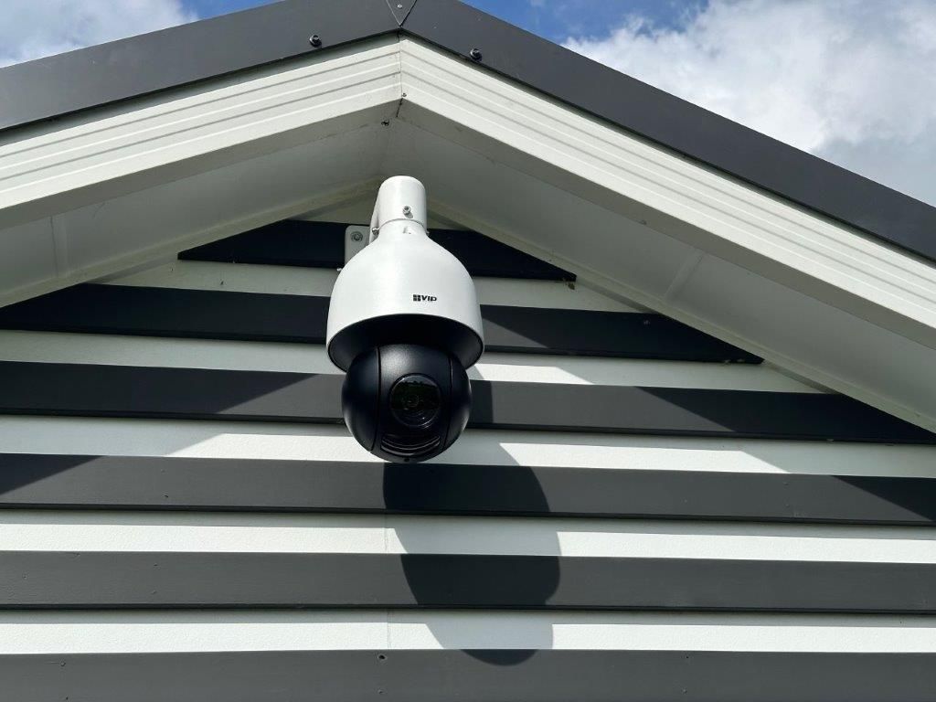 A Security Camera is Mounted on the Side of a Building — CTE Systems In Tuncurry, NSW