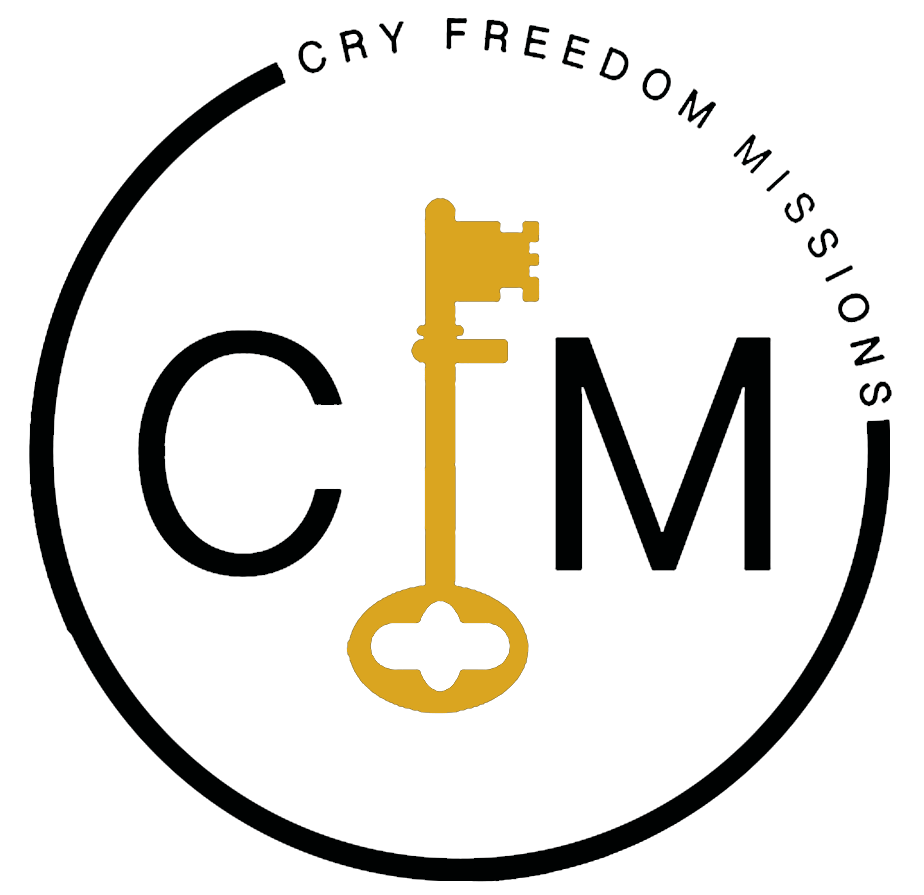 A logo for cry freedom missions with a key in a circle.