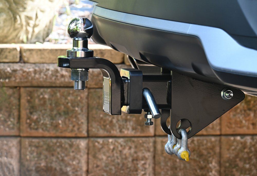 A Tow Hitch Is Attached To The Back Of A Car — Airlie Beach Exhaust and Mechanical In Whitsundays, QLD