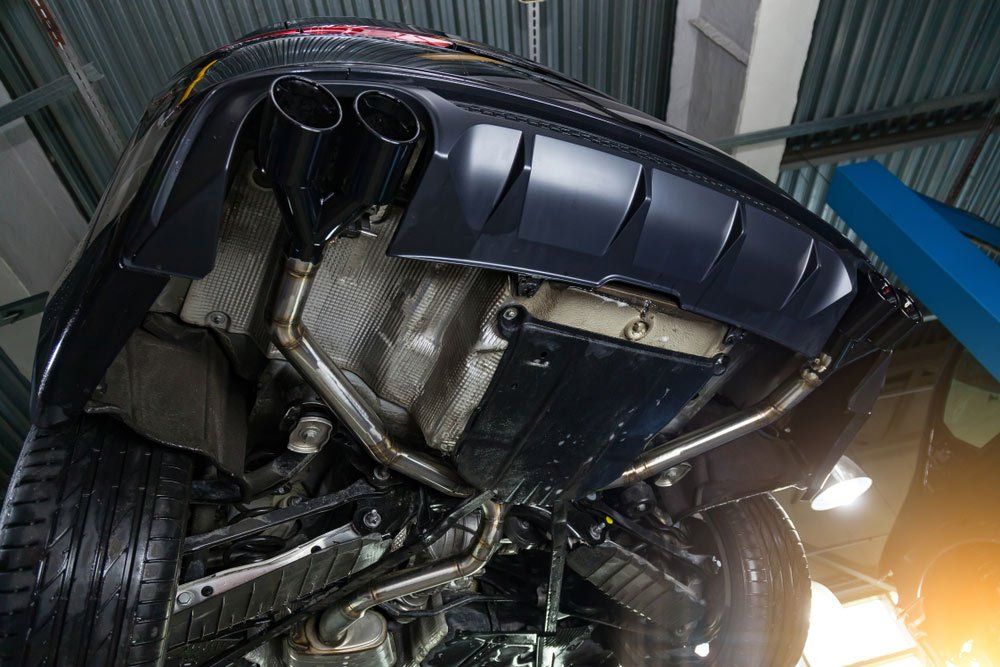 The Underside Of A Car Is Shown In A Garage — Airlie Beach Exhaust and Mechanical In Whitsundays, QLD