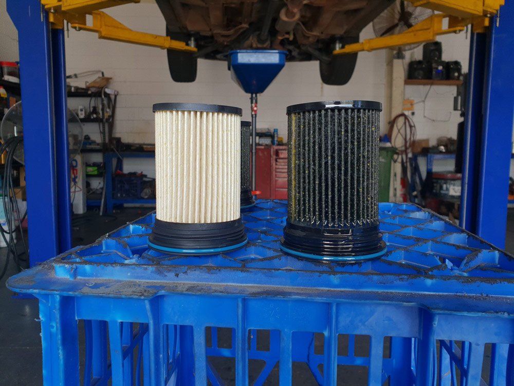 New And Old Car Oil Filter — Airlie Beach Exhaust and Mechanical In Cannonvale, QLD