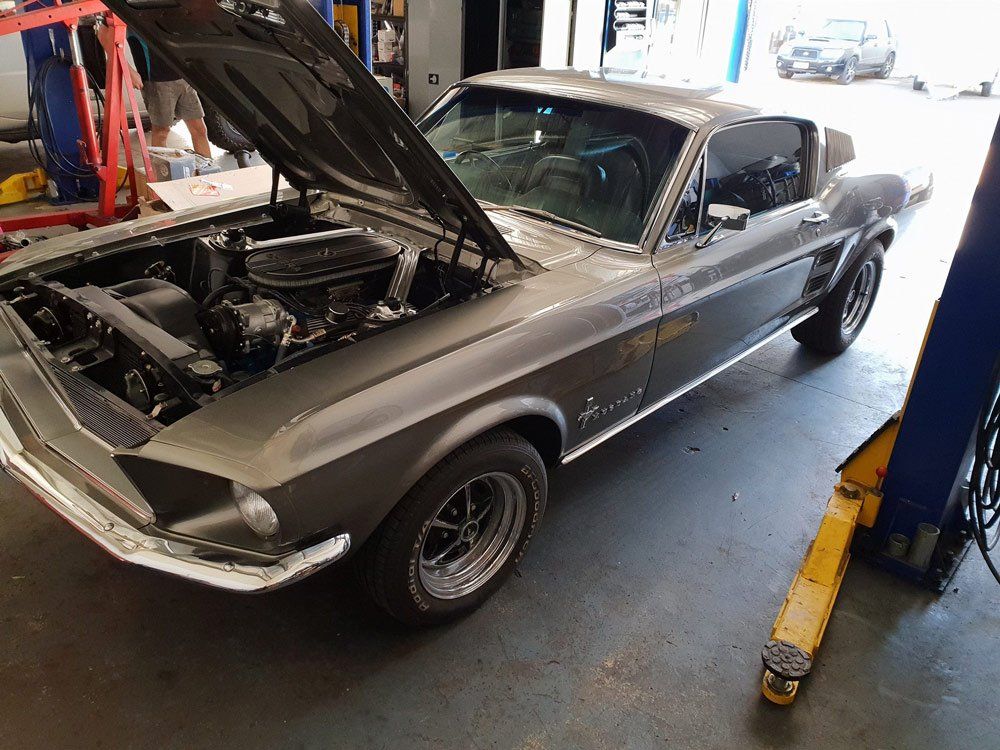 Old Model Vintage Car Repairing The Engine On The Shop — Airlie Beach Exhaust and Mechanical In Cannonvale, QLD