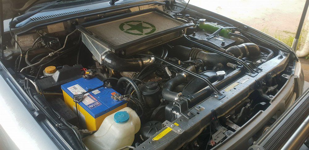 The Engine Of A Car Is Shown With The Hood Open — Airlie Beach Exhaust and Mechanical In Cannonvale, QLD