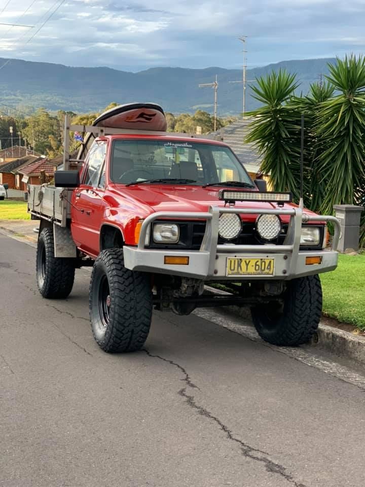 Red Toyota Pickup Truck Parked on a Street — D.A.G Automotive in Unanderra, NSW