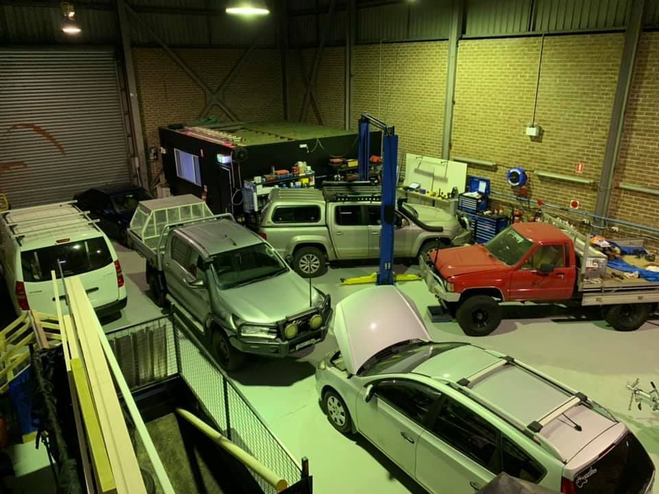 Cars and Trucks in a Repair Shop, Some on Lifts — D.A.G Automotive in Unanderra, NSW