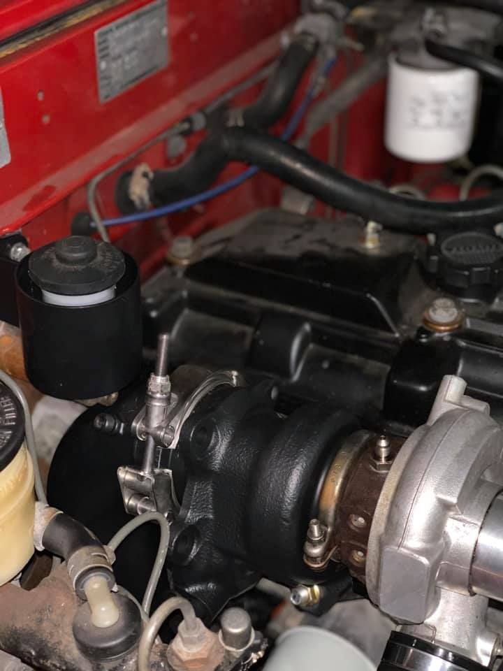 Black Turbocharged Engine in a Red Vehicle — D.A.G Automotive in Wollongong, NSW