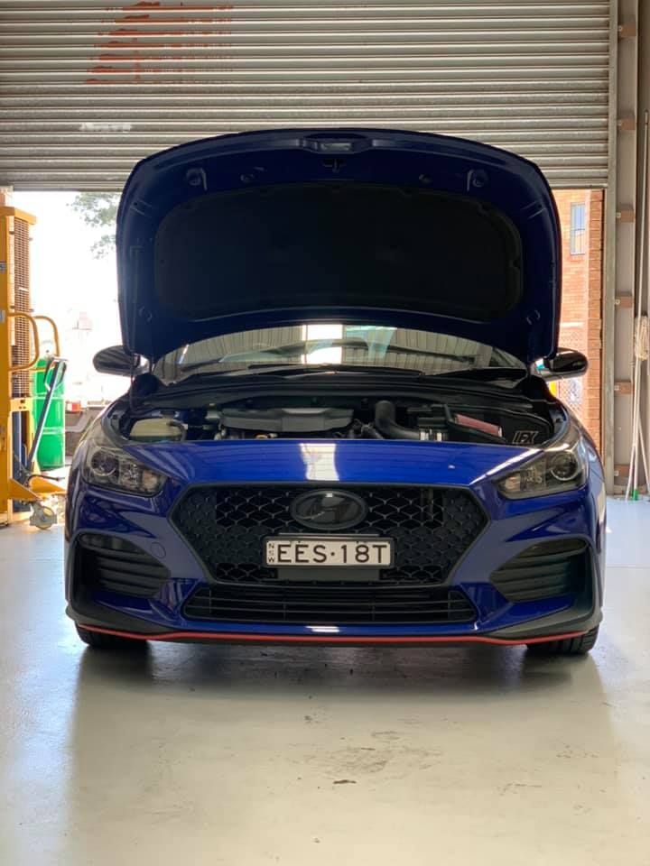 Blue Hyundai I30n With the Hood Up, in a Garage — D.A.G Automotive in Unanderra, NSW
