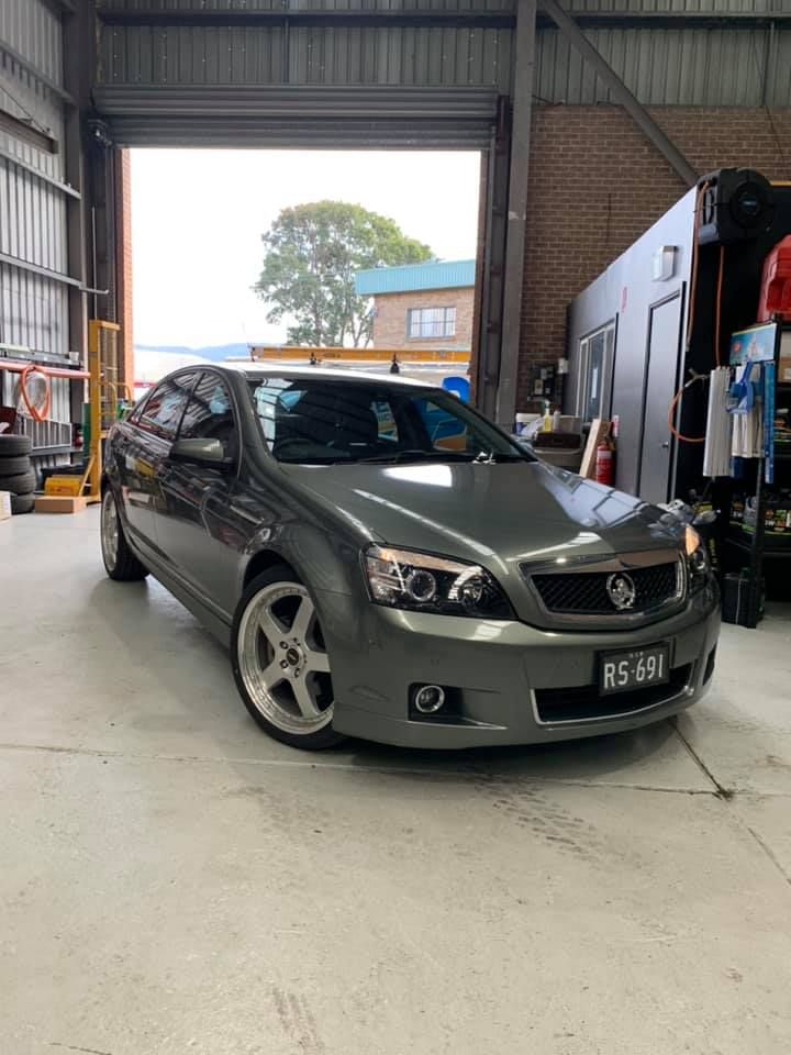 Gray Holden Commodore Sedan Parked Inside a Garage — D.A.G Automotive in Unanderra, NSW