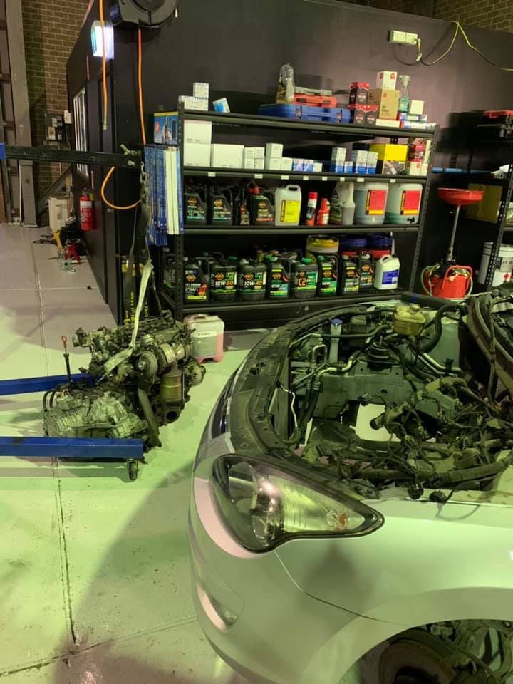 Car With Open Hood in a Repair Shop — D.A.G Automotive in Shellharbour, NSW