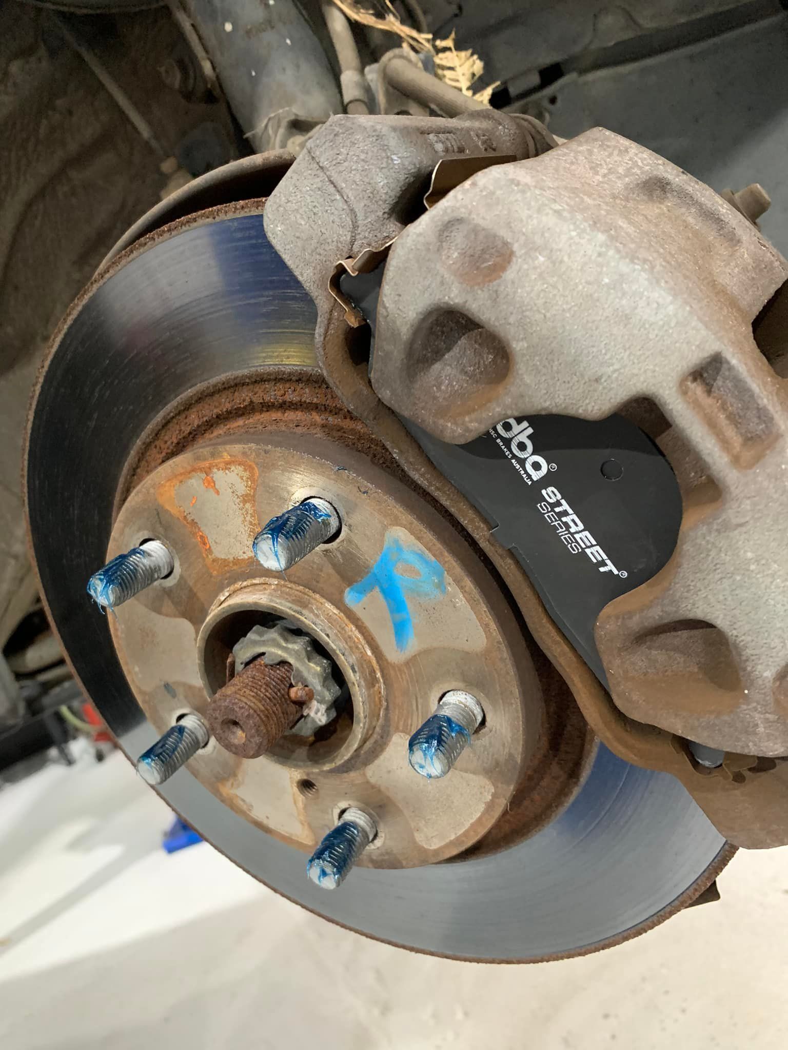 Car Brake Rotor With Caliper and Brake Pads — D.A.G Automotive in Unanderra, NSW