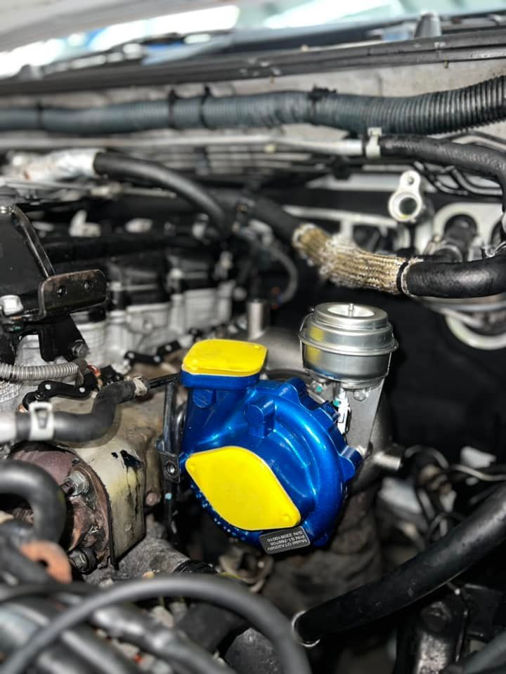 Blue and Yellow Engine Component in a Vehicle — D.A.G Automotive in Unanderra, NSW