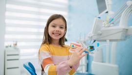 young girl with braces in a dental surgery