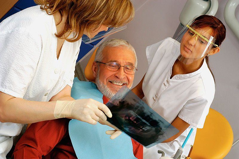 Senior receiving dental treatment