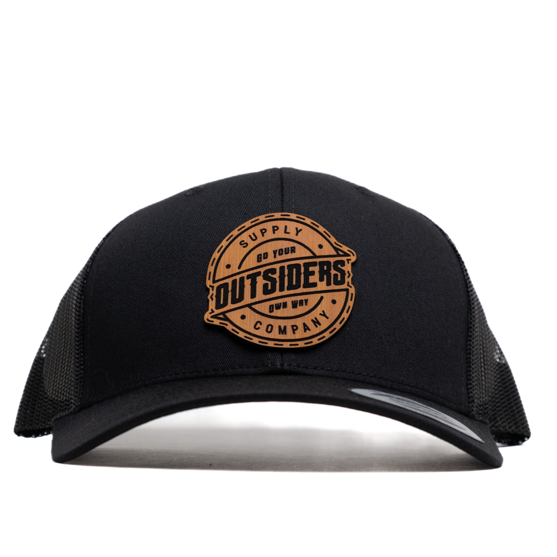 A black hat with a patch that says outsiders on it