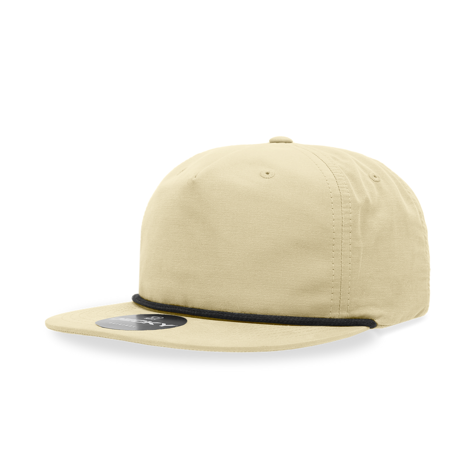 A beige baseball cap with a black rope around the brim