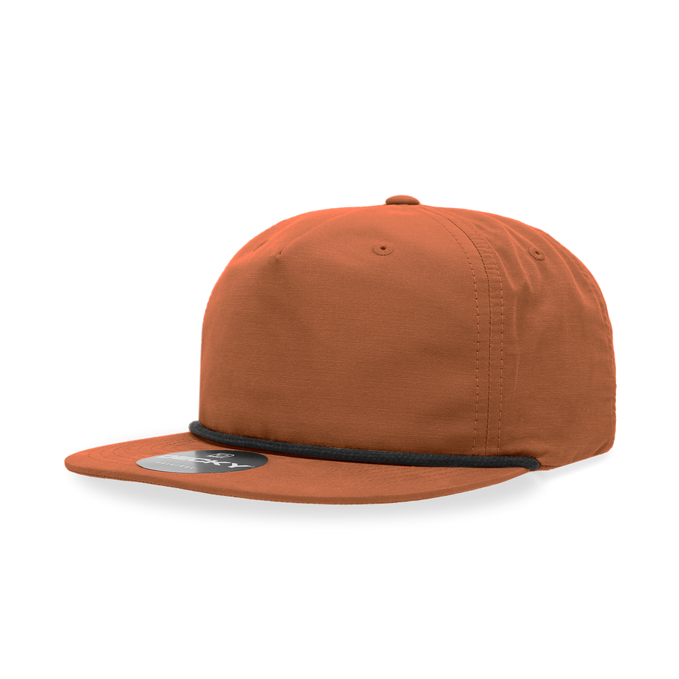 An orange baseball cap with a black rope around the brim