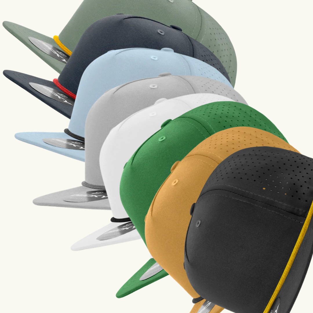 A bunch of different colored hats are lined up in a row