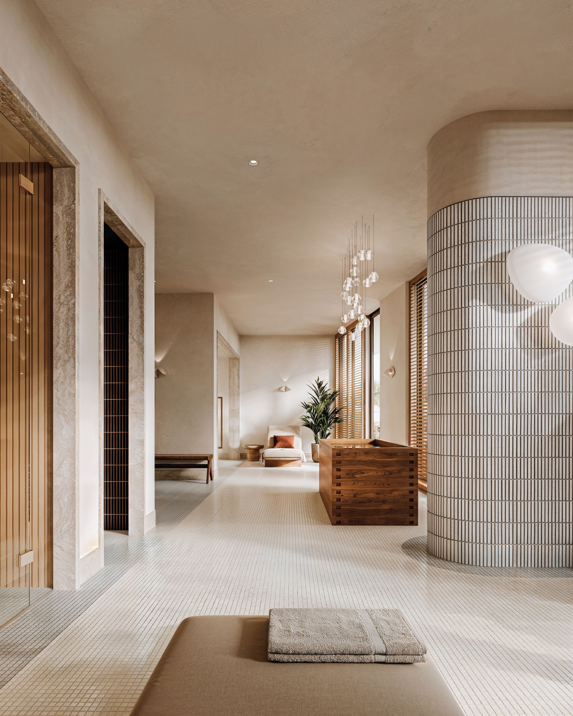 Sunlit outdoor patio with white walls, archways, green and white patterned floor, rattan chairs, and potted plants.
