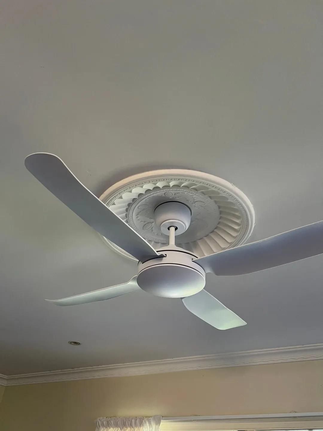 A White Ceiling Fan Is Hanging from The Ceiling of A Room — Next Level Resources In Rockhampton, QLD