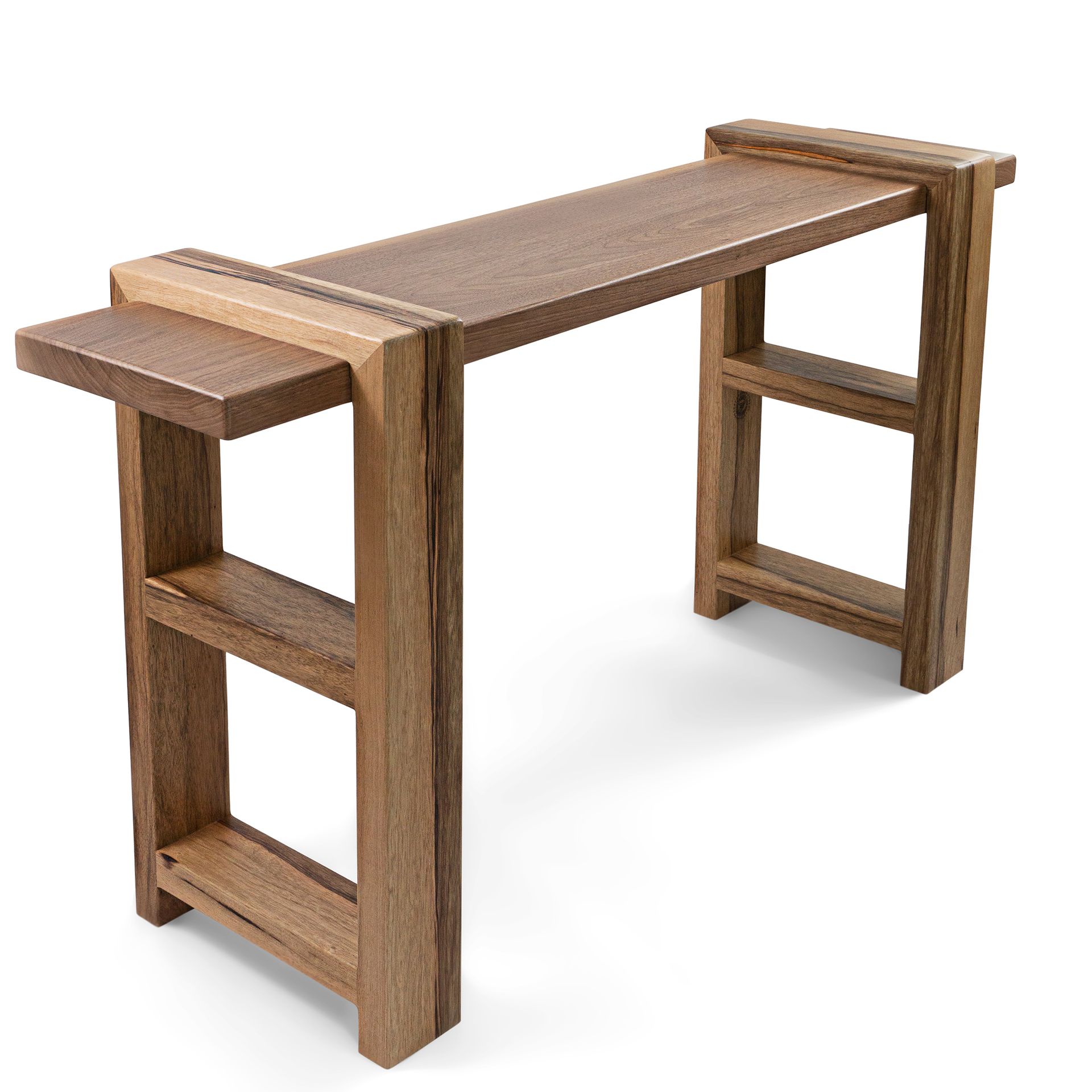 Wooden desk with built-in side shelf and lower shelves; warm brown tones.