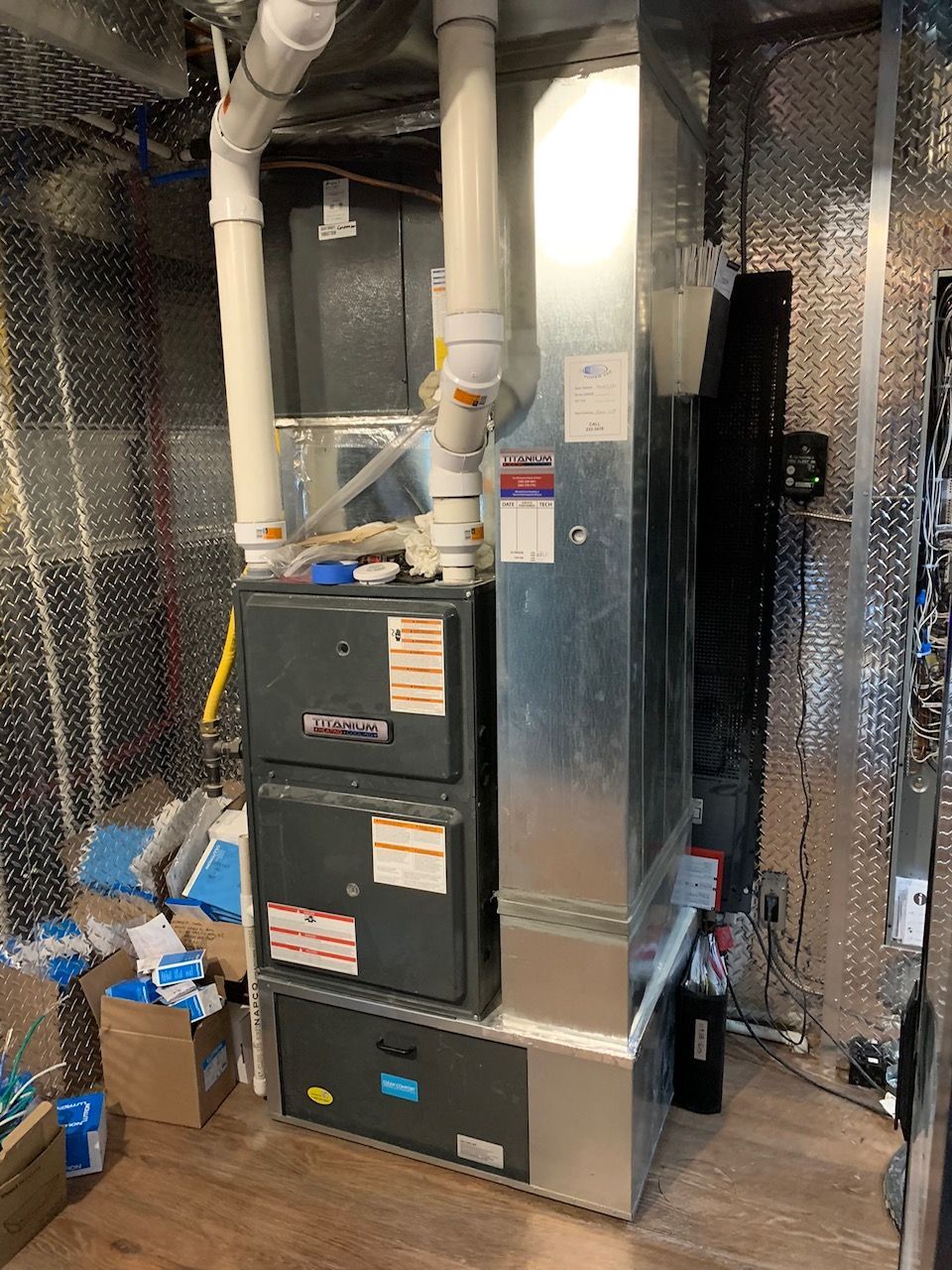 A large heating and cooling system is sitting in a room.