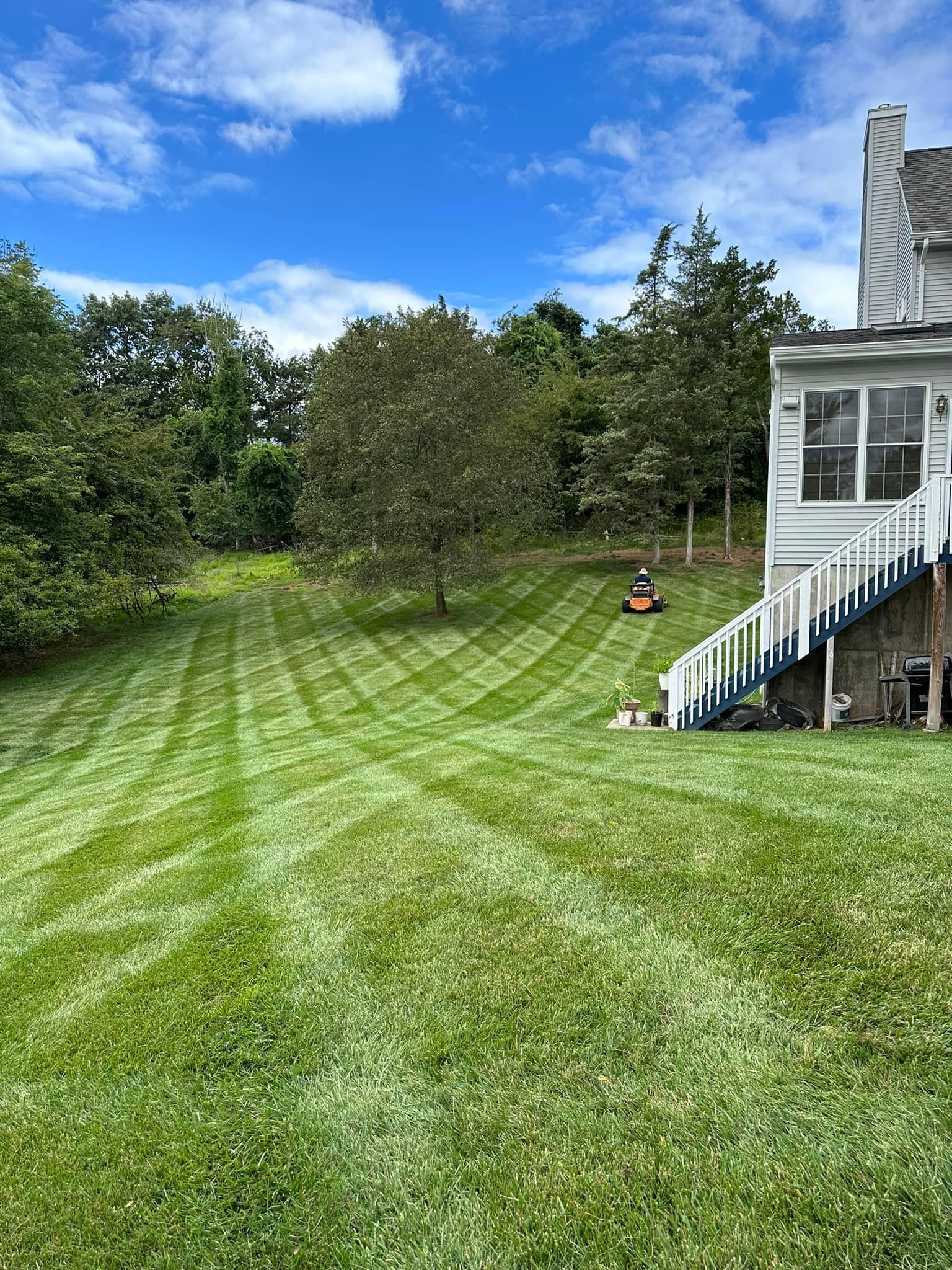 A lawn being professionally mowed in Somerville, NJ - L&L Custom Landscape Design hard at work.