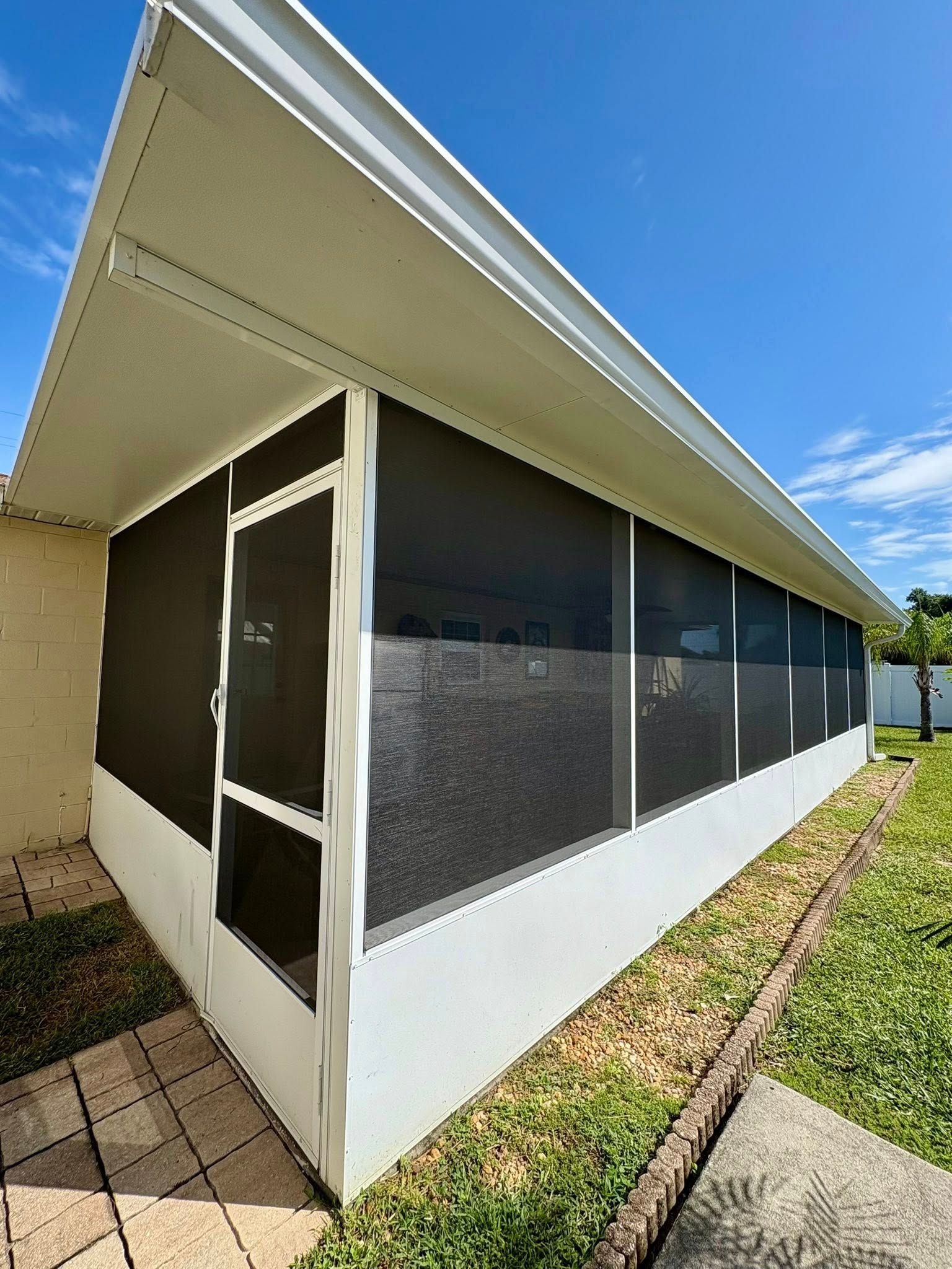 Trailer interior filled with black wrapped furniture and boxes.