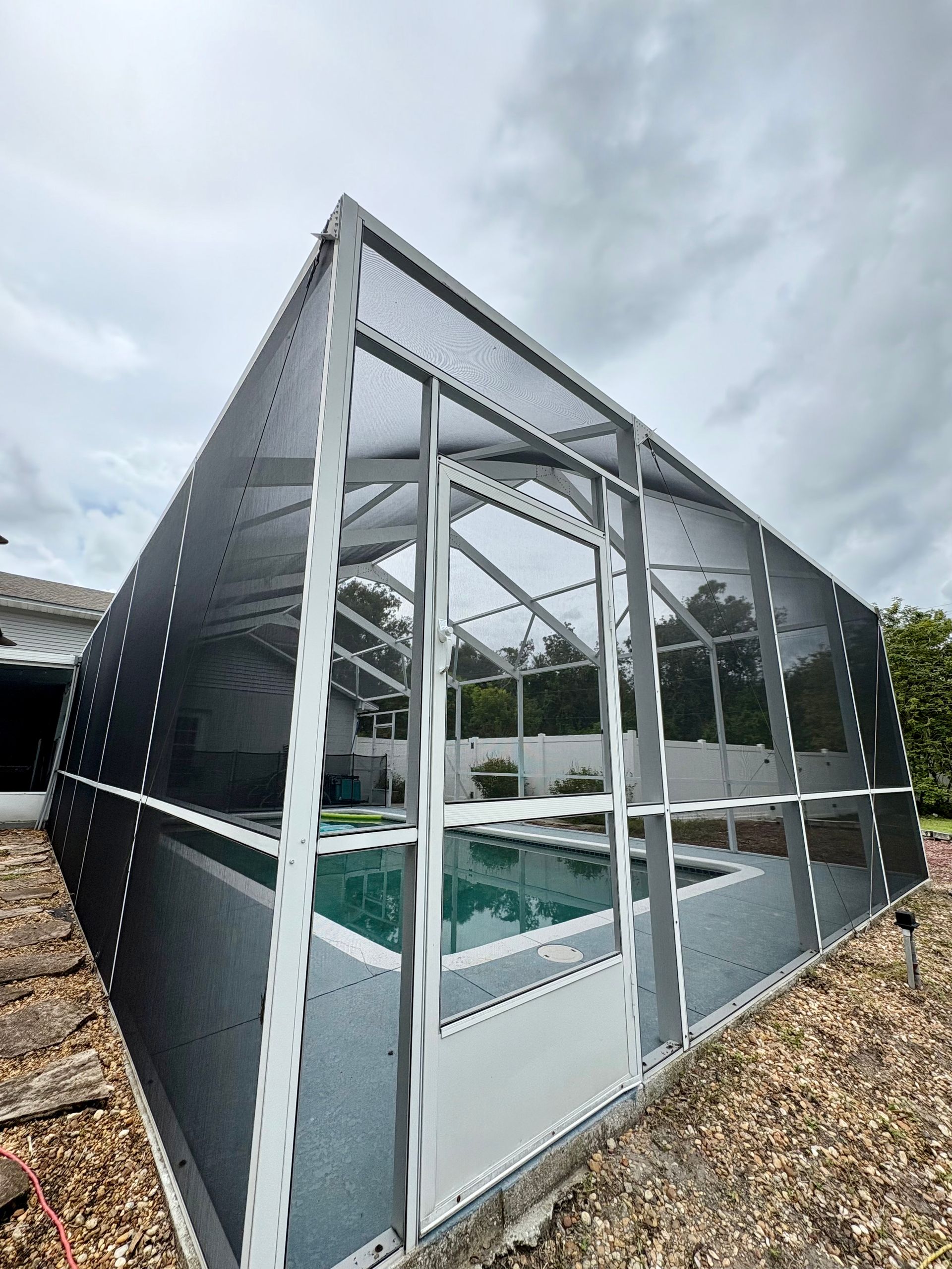 Long wooden dining table with six upholstered chairs.