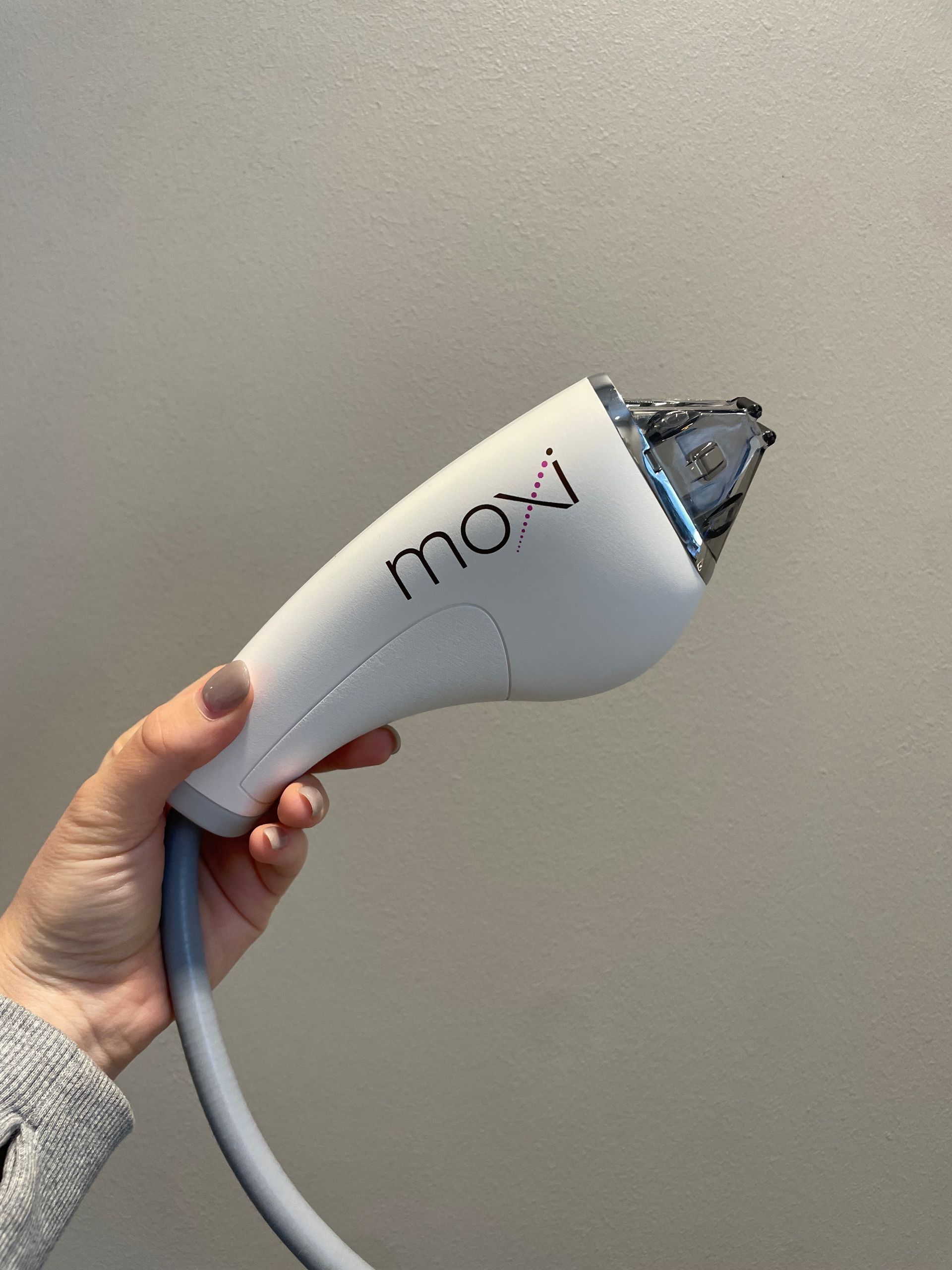 Hand holding a white 