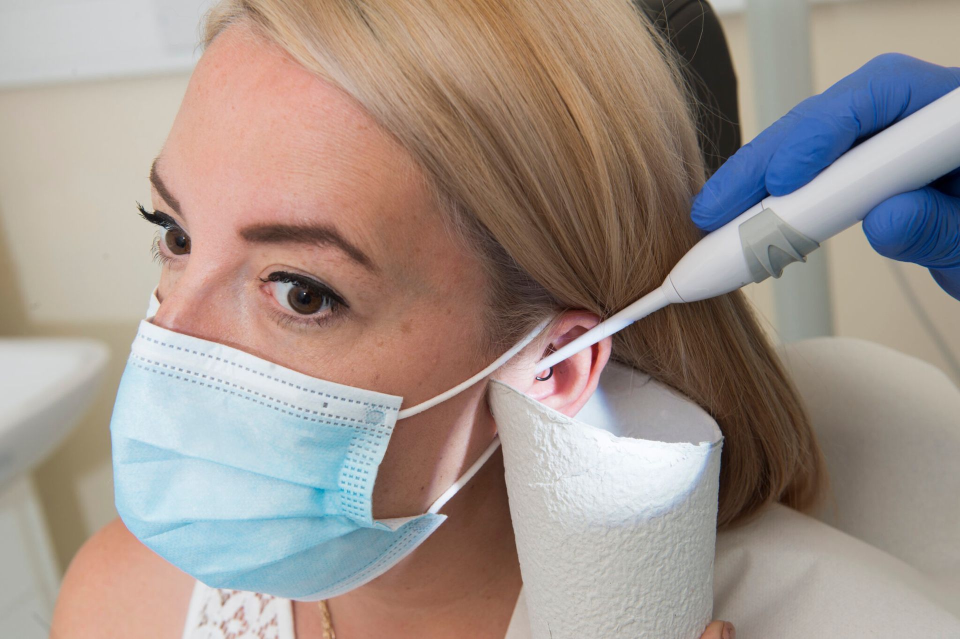 client getting irrigation modern day ear syringing in Grimsby