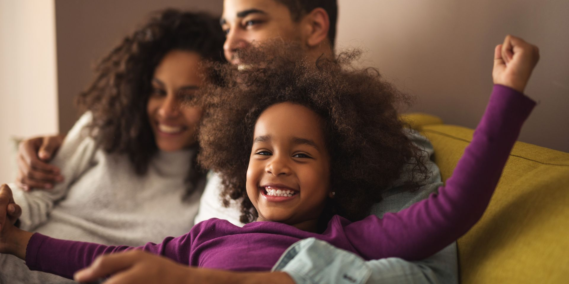 A family smiling having realised liquidity today with meaningful participation in long-term platform value creation.