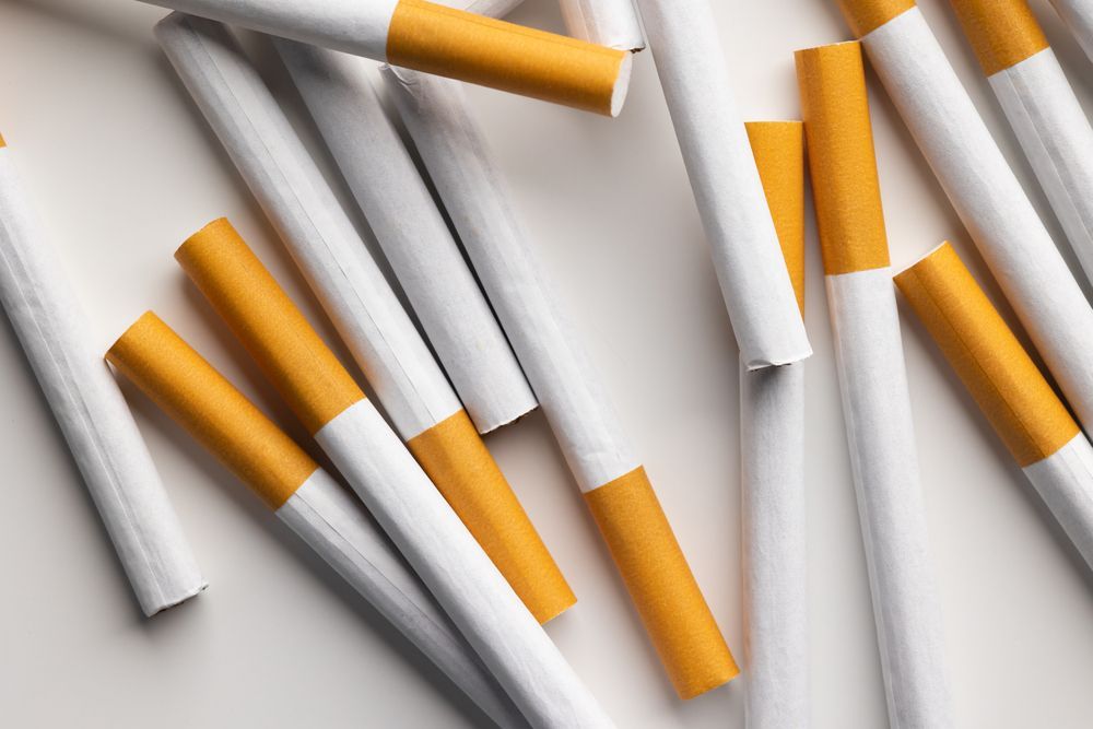 A Pile of Cigarettes on a White Surface — Howard Springs Supermarket In Howard Springs, NT
