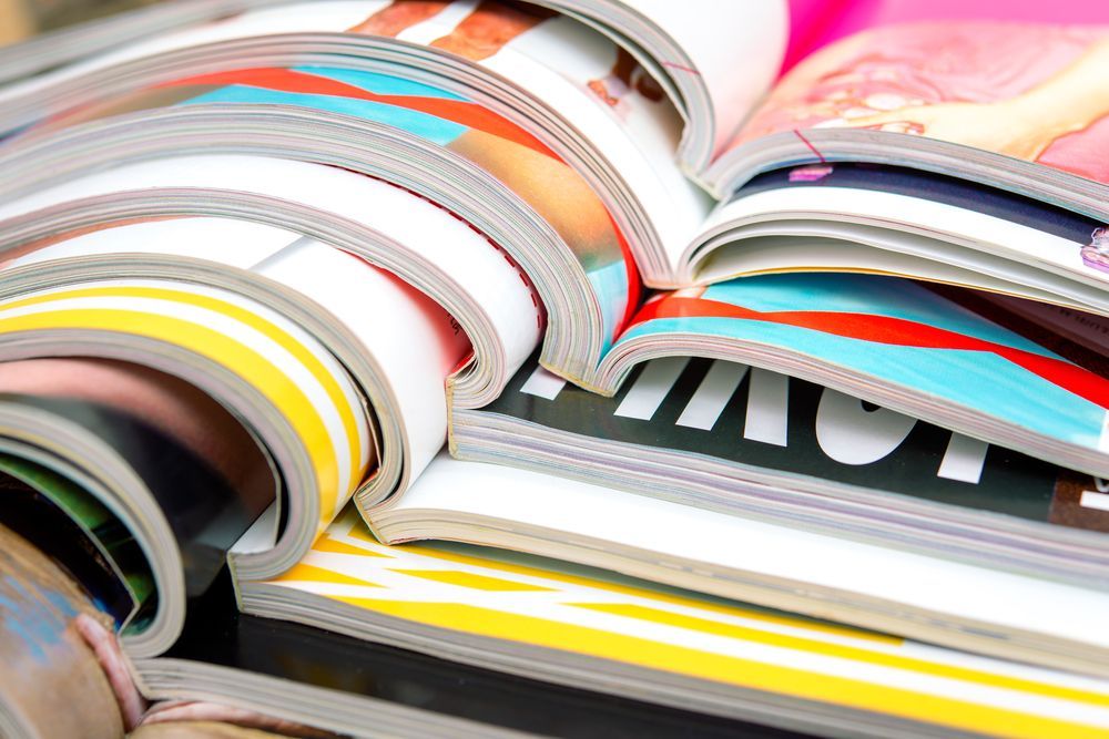 A Bunch of Magazines Are Stacked on Top of Each Other — Howard Springs Supermarket In Howard Springs, NT