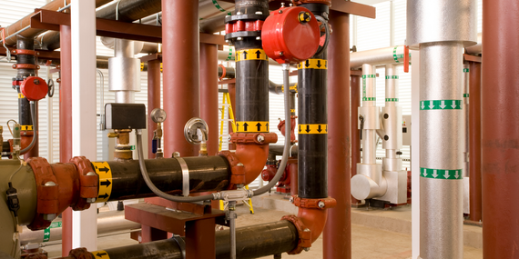 A bunch of pipes are lined up in a room