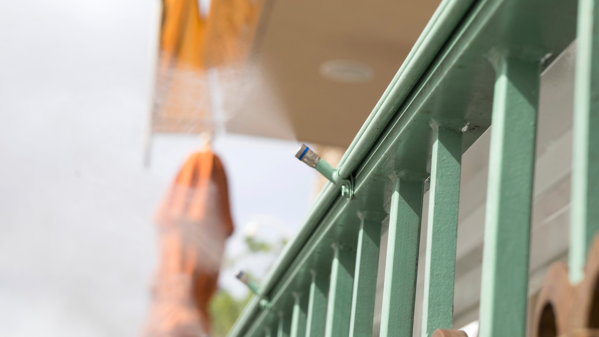 Water heater and filtration system in a garage setting, featuring copper pipes and tanks.
