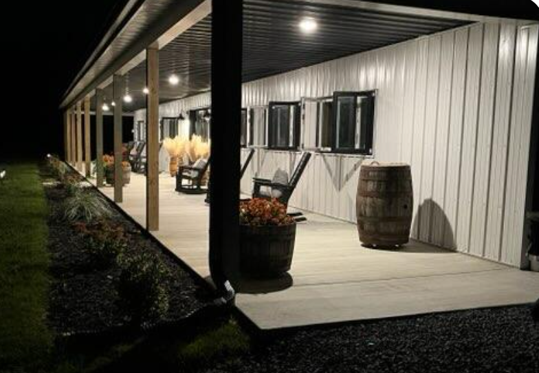 pole barn used as an office showing lit up at night